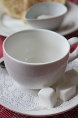 White mug with a plate in the restaurant