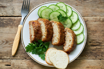 Baked meatloaf with pasta on a plate
