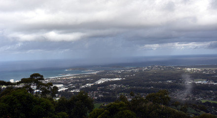 View of Coffs Harbour from Forest Sky Pier, which is a lookout pier with sweeping views on a cloudy day.