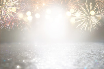abstract gold and silver glitter background with fireworks. christmas eve, 4th of july holiday concept