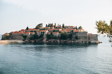 Fototapeta na wymiar Beautiful view of the island of Sveti Stefan in Montenegro. One of the famous sights of Montenegro.