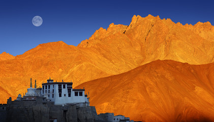 Lamayuru Buddhist monastery, scenic mountain view with full moon and sunset, Ladakh, India - obrazy, fototapety, plakaty