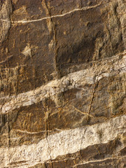 Fototapeta premium Typical detail of an ancient Italian house wall, made of hand-carved river stones.