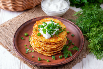 Pancakes with cheese with sour cream