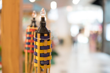 An oil lamp or pelita with bamboo holder for Eid ul fitr decoration.