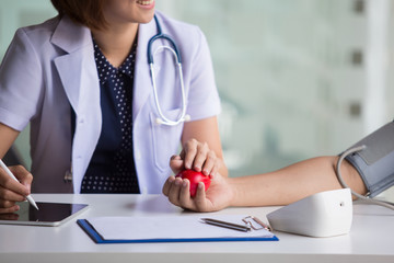 Smiling doctor and patient are discussing something