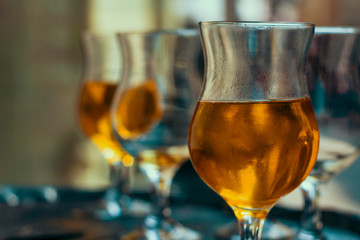 Glasses with an alcoholic beverage / close up detail / toned