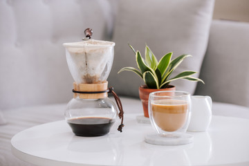 Breakfast with chocolate cake and coffee served on a beautiful living home