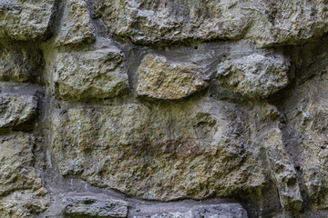 The wall made of grey rocks  