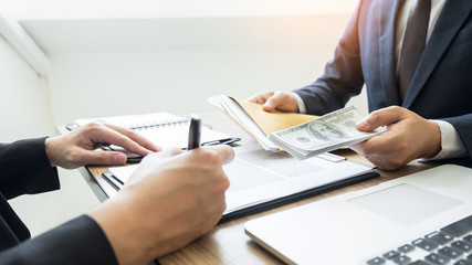 bribe and corruption concept, Corrupted businessman sealing the deal hand receiving venality bribe money from partner