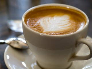 Cup of cappuccino coffee closeup