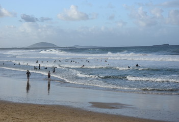 People relaxing at the beach in Autumn time afternoon.  Alex is a coastal town situated on...
