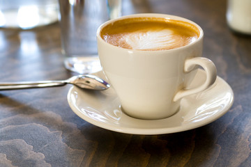 Cup of cappuccino coffee closeup