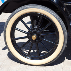 The wheel of an old car of the early twentieth century