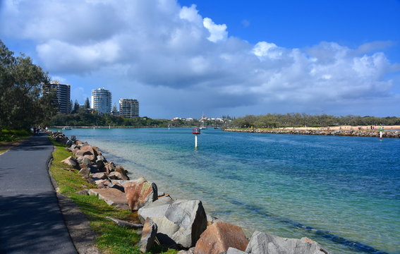 Buddina, Australia - Apr 21, 2019. Mooloolaba Marina on Mooloolah River on a sunny but cloudy day. Rock wall along Mooloolah river (Sunshine Coast, Queensland, Australia).