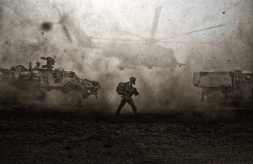 Military forces between storm & dust in desert