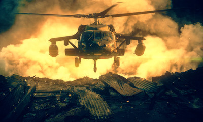 Military helicopter between fire and smoke in destroyed house