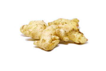 Raw ginger root isolate on white background. Ginger root originated as ground flora of tropical lowland forests in regions from the Indian. Widely used as a spice or a folk medicine.