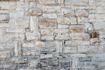 Stone wall. Horizontally-vertical laying of a stone.
