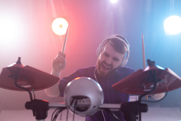 hobby, music and people concept - Drummer with drum sticks making music