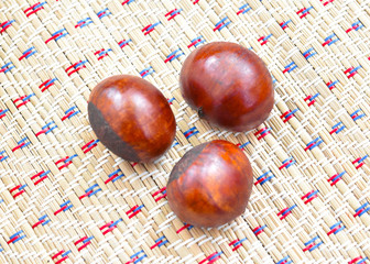 Chestnuts on the mat background
