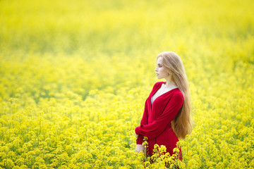Fototapeta premium redhead girl in yellow field