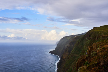 Naklejka premium Cliff and blue ocean view in Madeira island, near Ponta do Pargo, Portugal