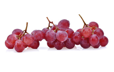 Ripe red grape with drops isolated on white.