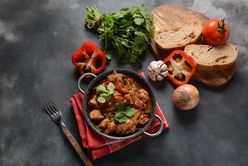 Chakhokhbili - traditional Georgian dish. Chicken stewed with fresh coriander tomatoes and herbs