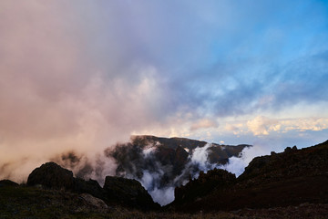 Mountain view from pico de arieiro with mountains, ocean, clouds and blue sky