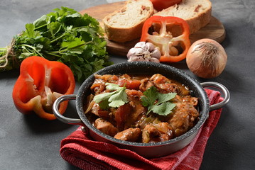 Chakhokhbili - traditional Georgian dish. Chicken stewed with fresh coriander tomatoes and herbs