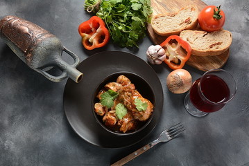 Chakhokhbili - traditional Georgian dish. Chicken stewed with fresh coriander tomatoes and herbs -