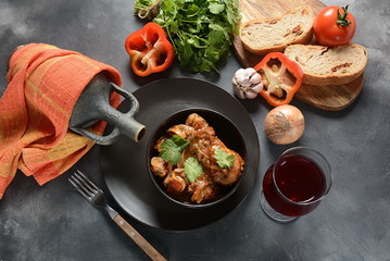 Chakhokhbili - traditional Georgian dish. Chicken stewed with fresh coriander tomatoes and herbs