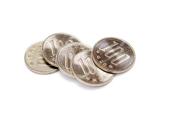 Closeup 100 Japan yen currency coins stacked on white background
