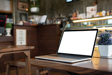 Blank screen laptop on table template.Laptop computer white screen for insert UI (User Interface) design mock up.