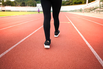 female woman exercise running at sport stadium