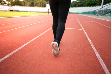 Fototapeta premium female woman exercise running at sport stadium