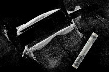 Cocaine lines isolated on black background, clipping path 