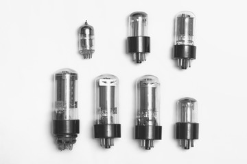 Old radio lamps isolated on a gray background.