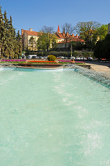 fountains with flower beds in the city and parks of a beautiful sunny day under the blue sky