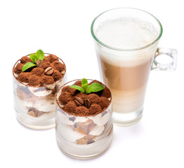 Classic tiramisu dessert in a glass and cup of coffee isolated on a white background with clipping path