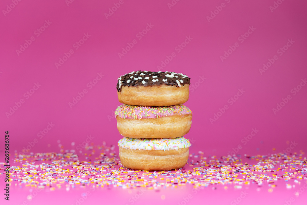 Wall mural doughnuts pink background