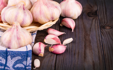The Fresh Garlic on the wooden background