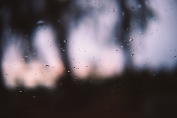 rain drops on window at dusk