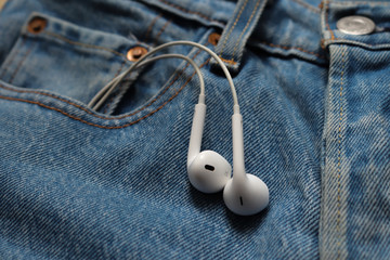 earphones in jeans pocket