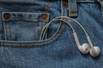 earphones in jeans pocket