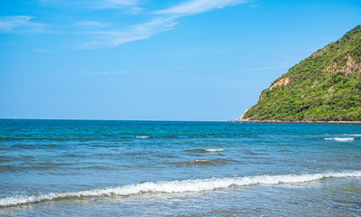 Summer beach with sea view and mountain from tropical beach with sunny sky