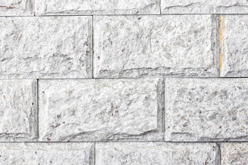 close up on wall of white stones with details, stone texture
