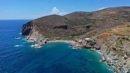 Obraz premium Aerial drone photo of secluded deep turquoise beach of Agios Nikolaos with crystal clear sea and sandy sea shore, Folegandros island, Cyclades, Greece