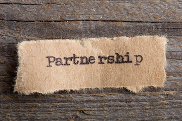 Partnership word on a piece of paper close up, business creative motivation concept